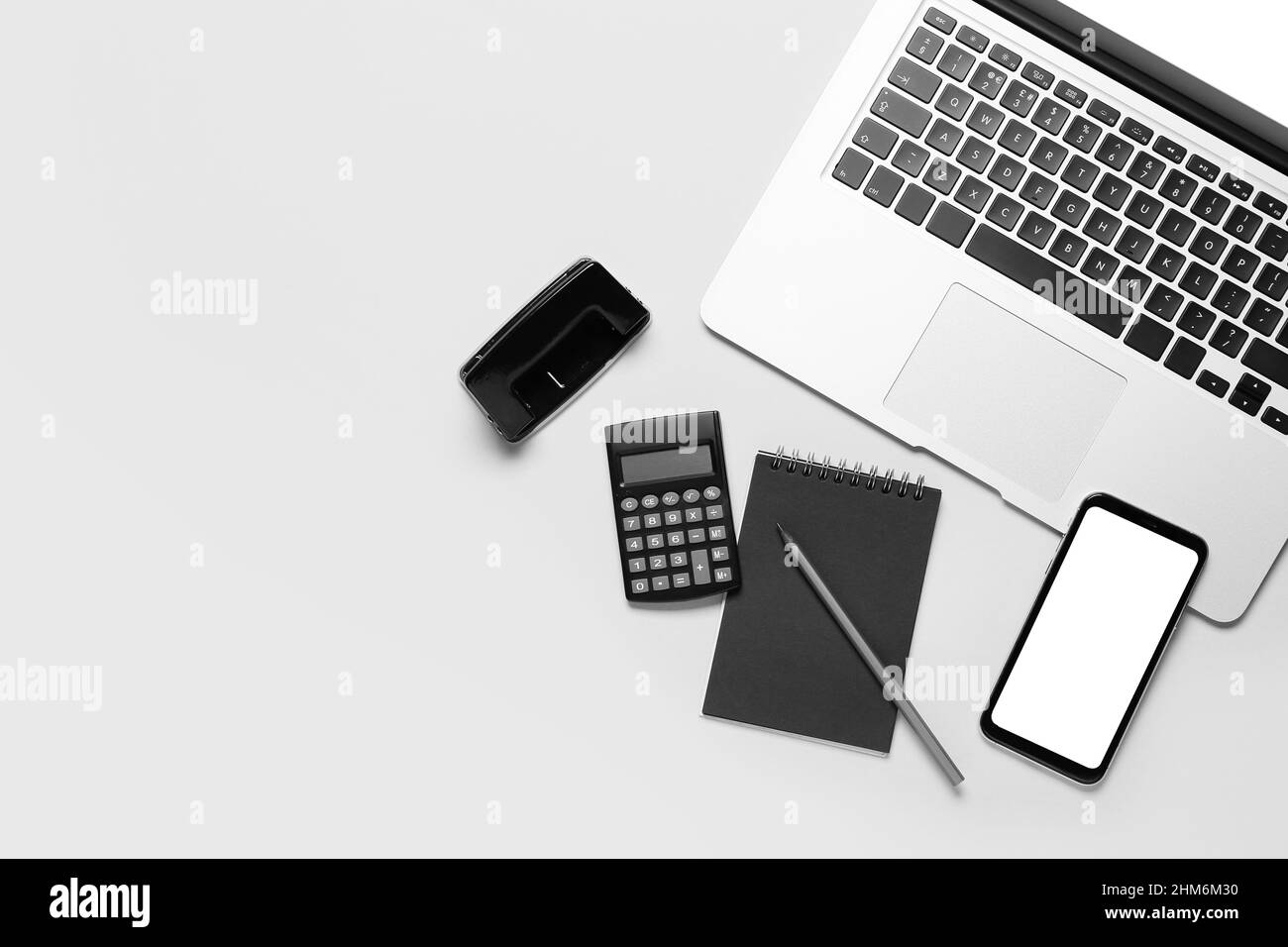 Modern laptop, mobile phone and stationery on white background Stock ...