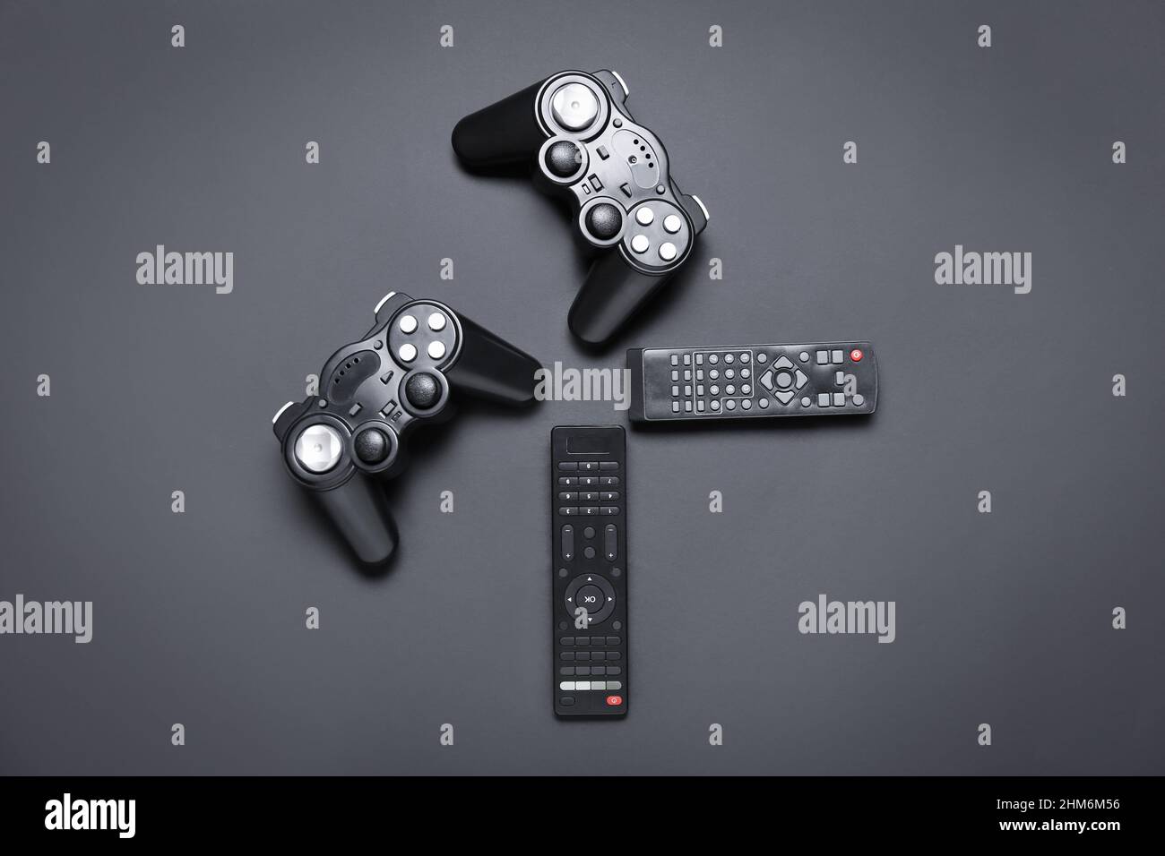 Remote controllers and joysticks on dark background Stock Photo - Alamy