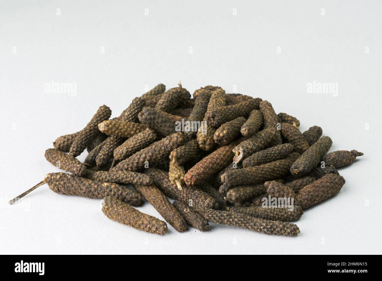 Pile of ripe Long peppers (Piper longum) Stock Photo