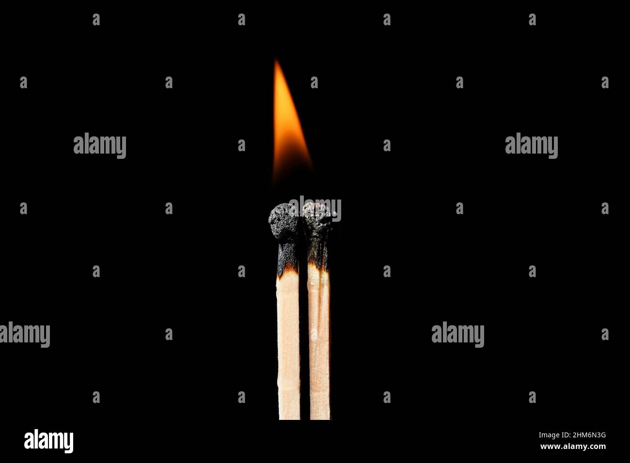 Burning matches on black background. Concept of relationship burnout