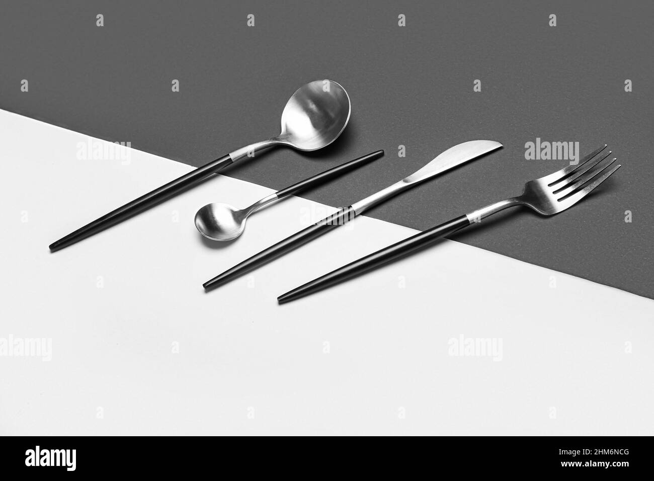 Set of stainless steel cutlery on black and white background Stock