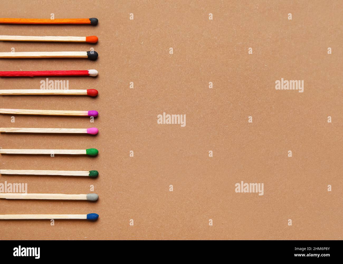 Different new matchsticks on brown background Stock Photo - Alamy