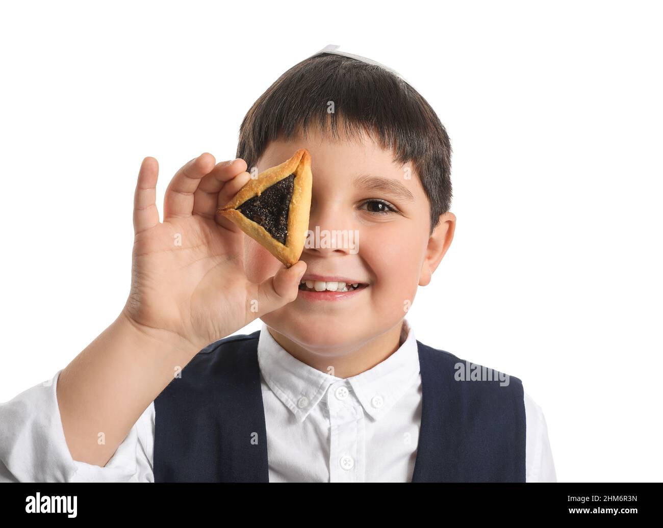Little Jewish boy with tasty Hamantaschen for Purim holiday on white ... Little Jewish boy with tasty Hamantaschen for Purim holiday on white ...