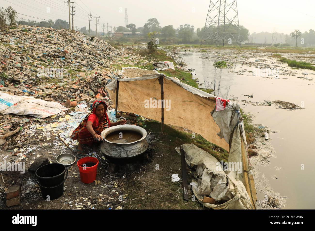 Dhaka, Bangladesh. 3rd Feb, 2022. A woman seen working around plastic