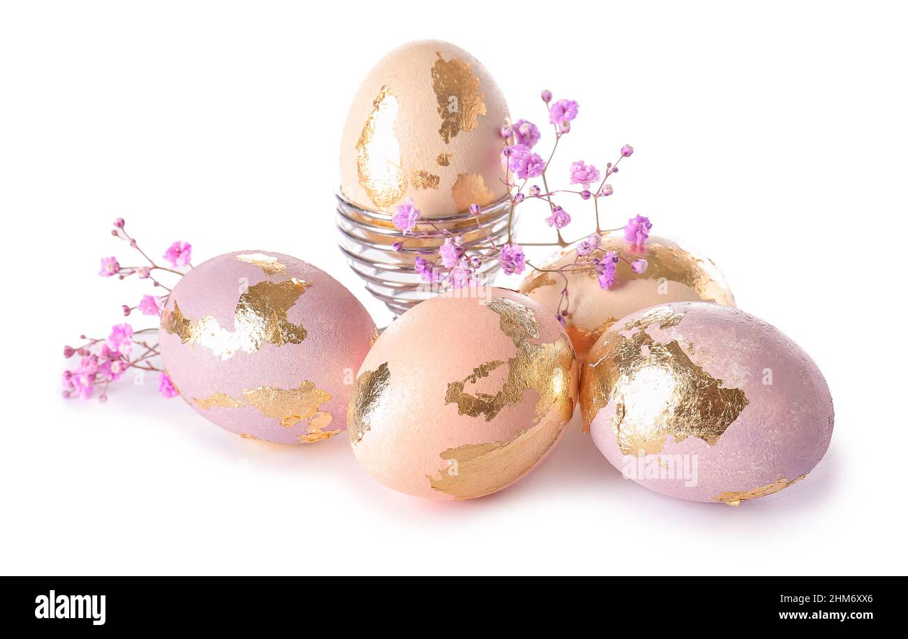Beautiful Easter eggs and gypsophila flowers on white background Stock ...