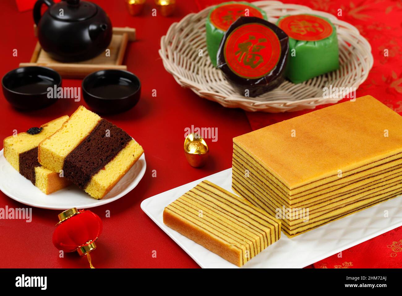 Chinese New Year Cake, Nian Gao, Lapis Legit, and Spiku. Served with Tea. Chinese Character is Fu Means Fortune Stock Photo