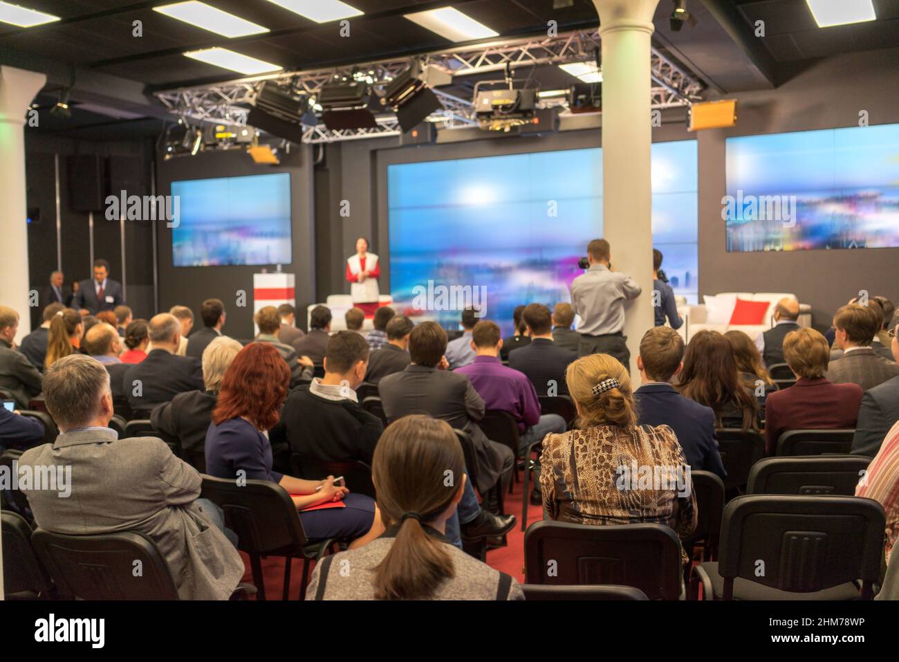 Business Conference and Presentation. Audience at the conference hall. Stock Photo