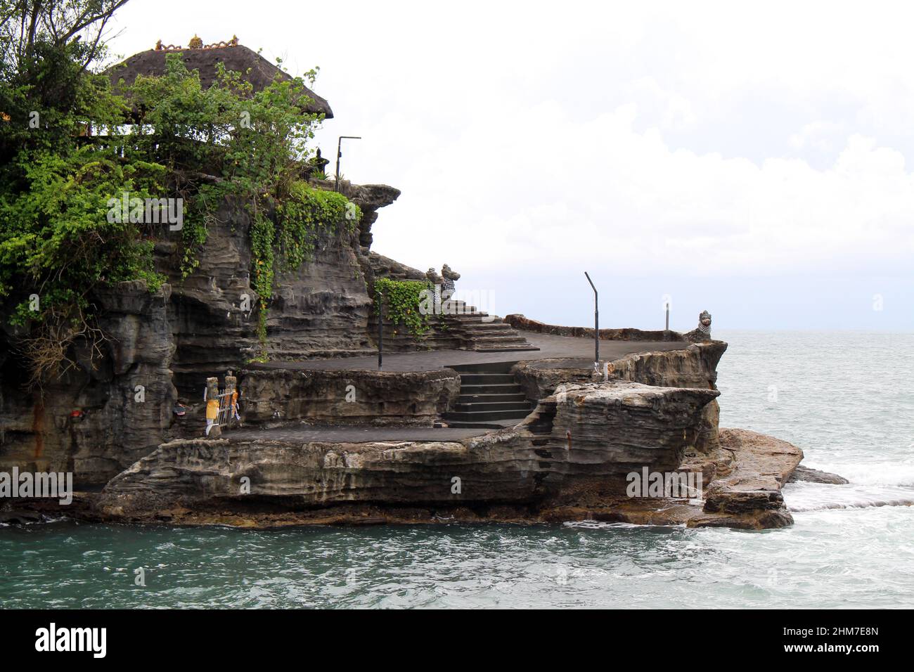 A closer view of Tanah Lot, a Balinese Hindu temple on top of cliff and ...