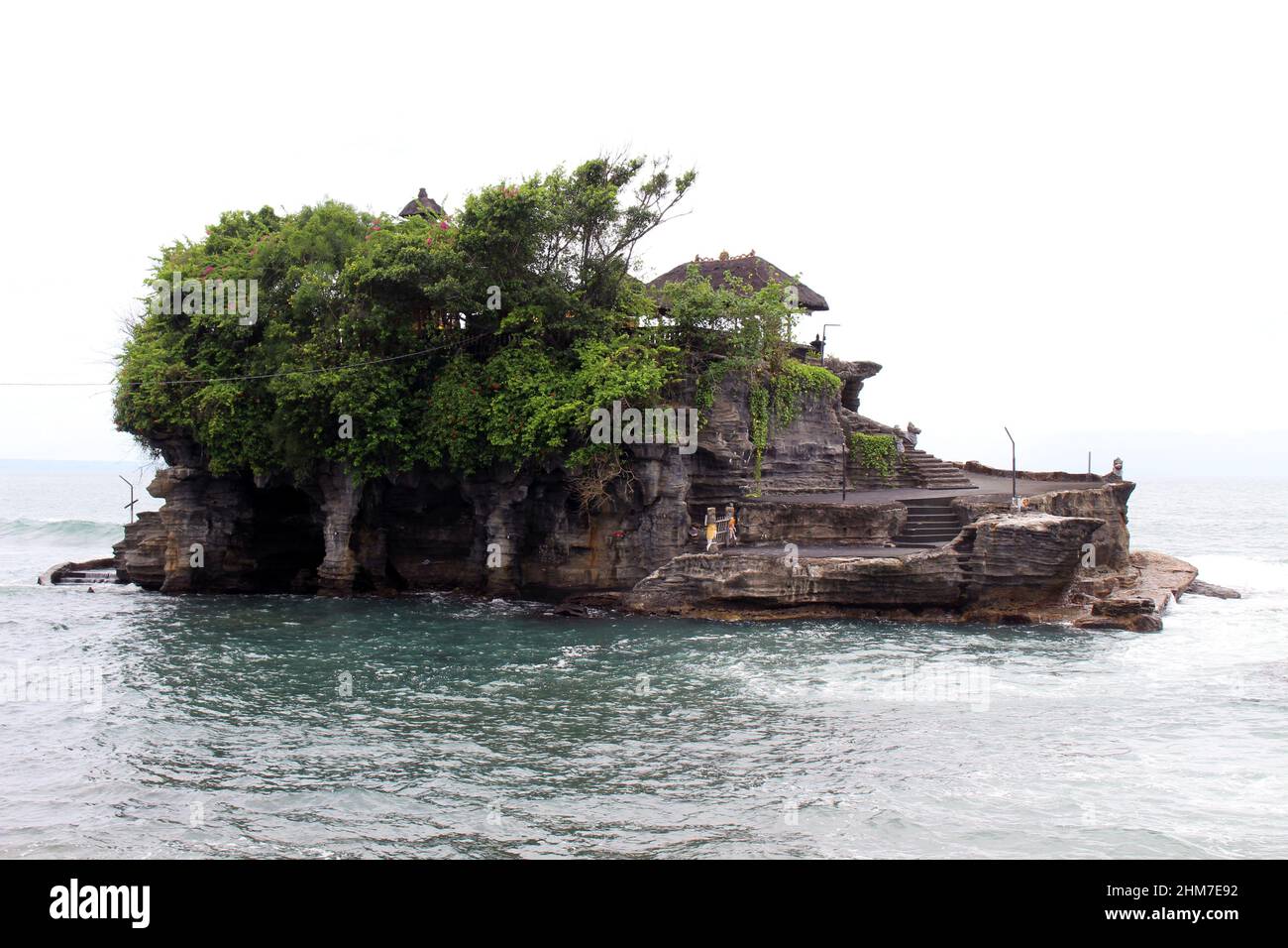 A closer view of Tanah Lot, a Balinese Hindu temple on top of cliff and ...