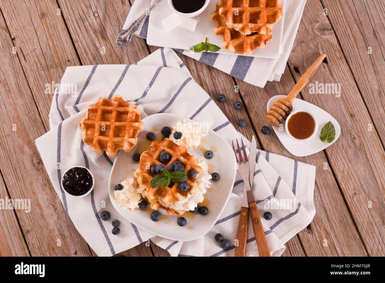 Waffles with blueberries and whipped cream Stock Photo - Alamy