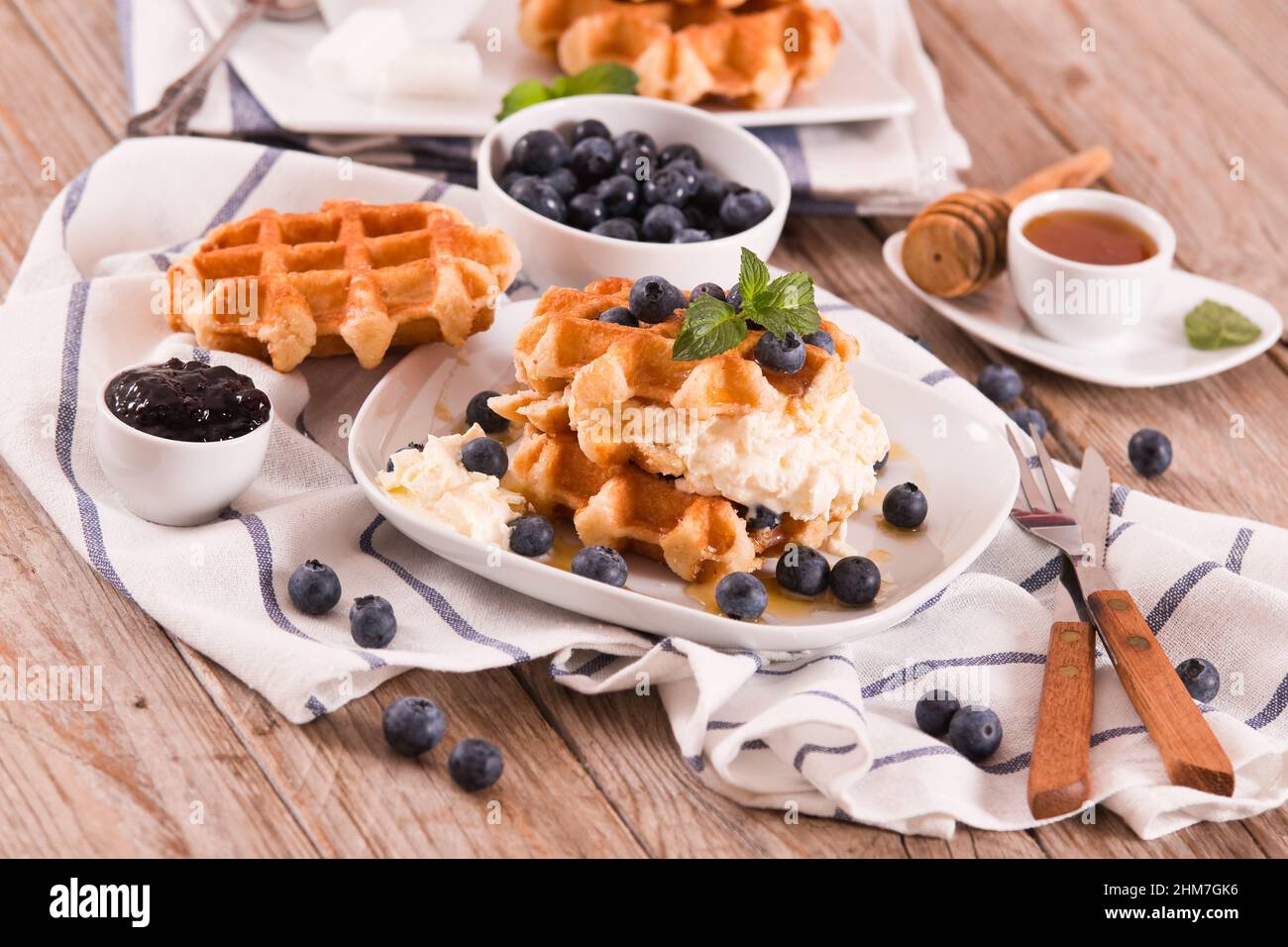 Waffles with blueberries and whipped cream Stock Photo - Alamy