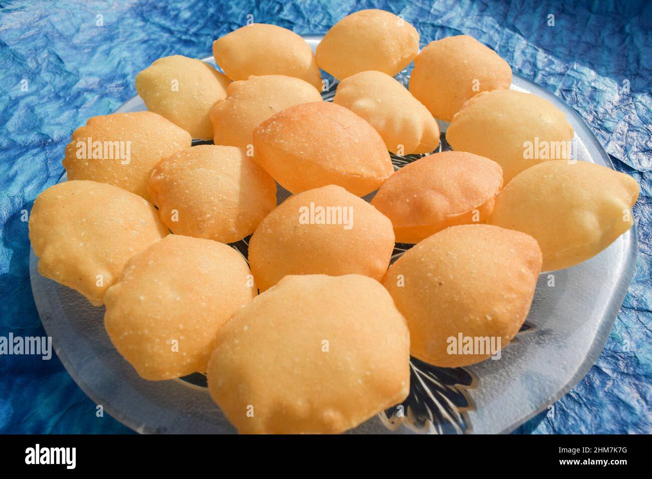 Indian and Pakistani street food item Pani puri or Gol gappa or Puchka. Big size puri used for filling spicy water and potato made of sooji Stock Photo