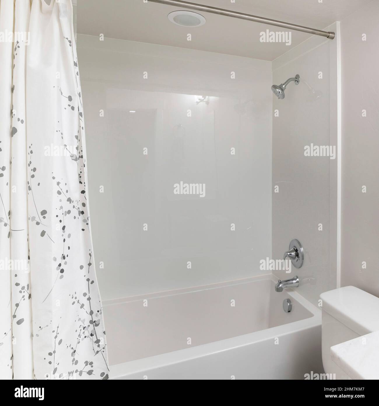 Square Small windowless white bathroom interior with shower tub combo