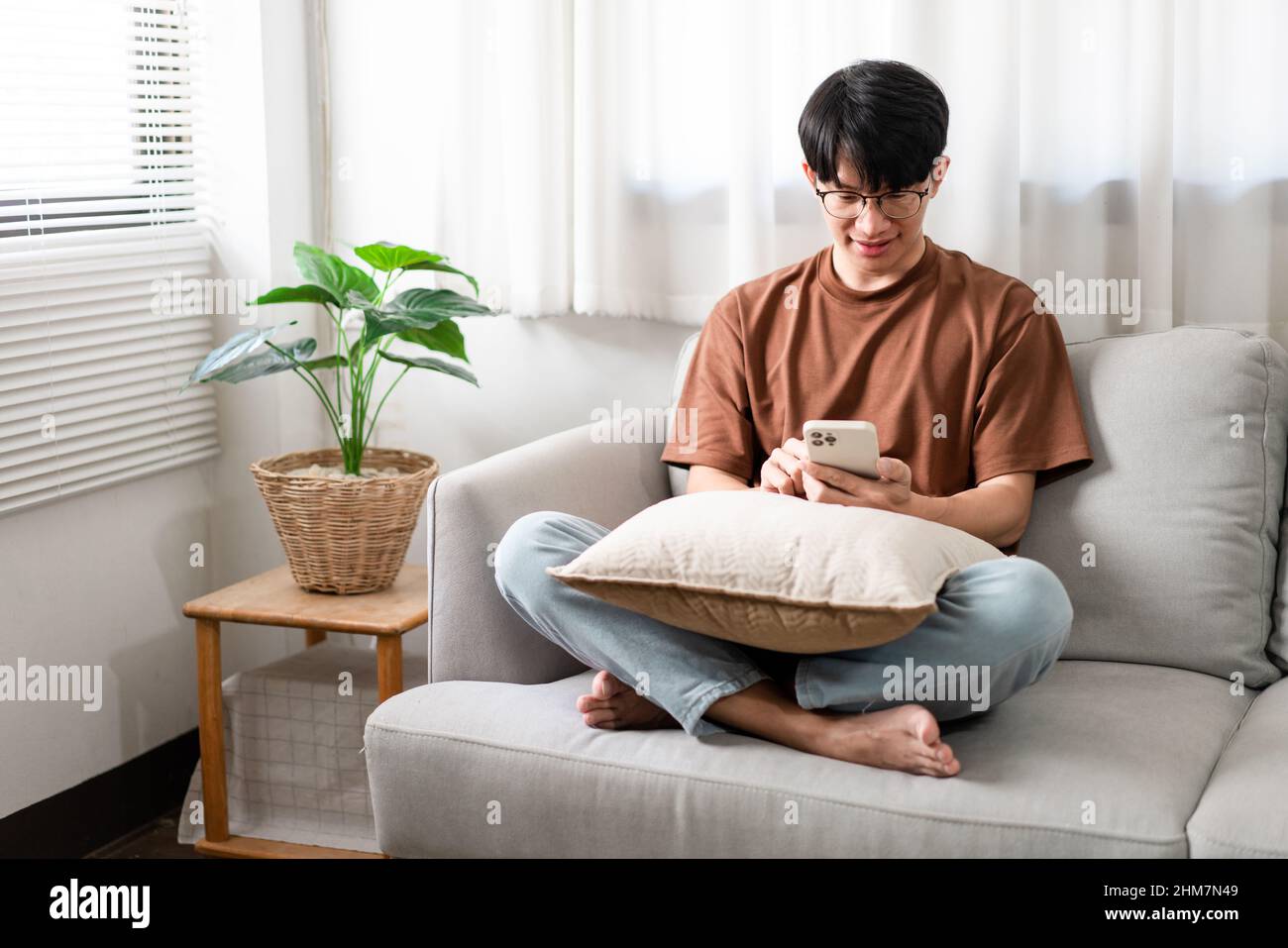 Technology Concept The man sitting next to a pot of plant, putting a