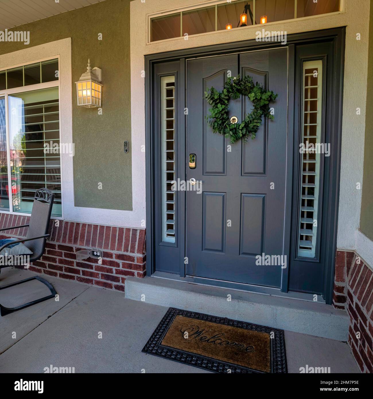 Square Front porch exterior with lounge chairs and red bricks Stock
