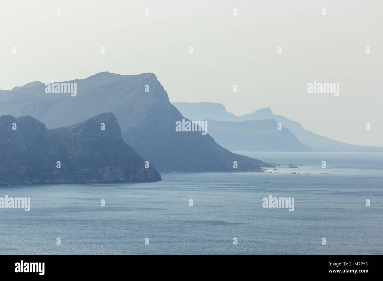 View on the Ocean with mountains in the background in a misty day at the Cape of Good Hope south of Cape Town in the Western Cape of South Africa Stock Photo