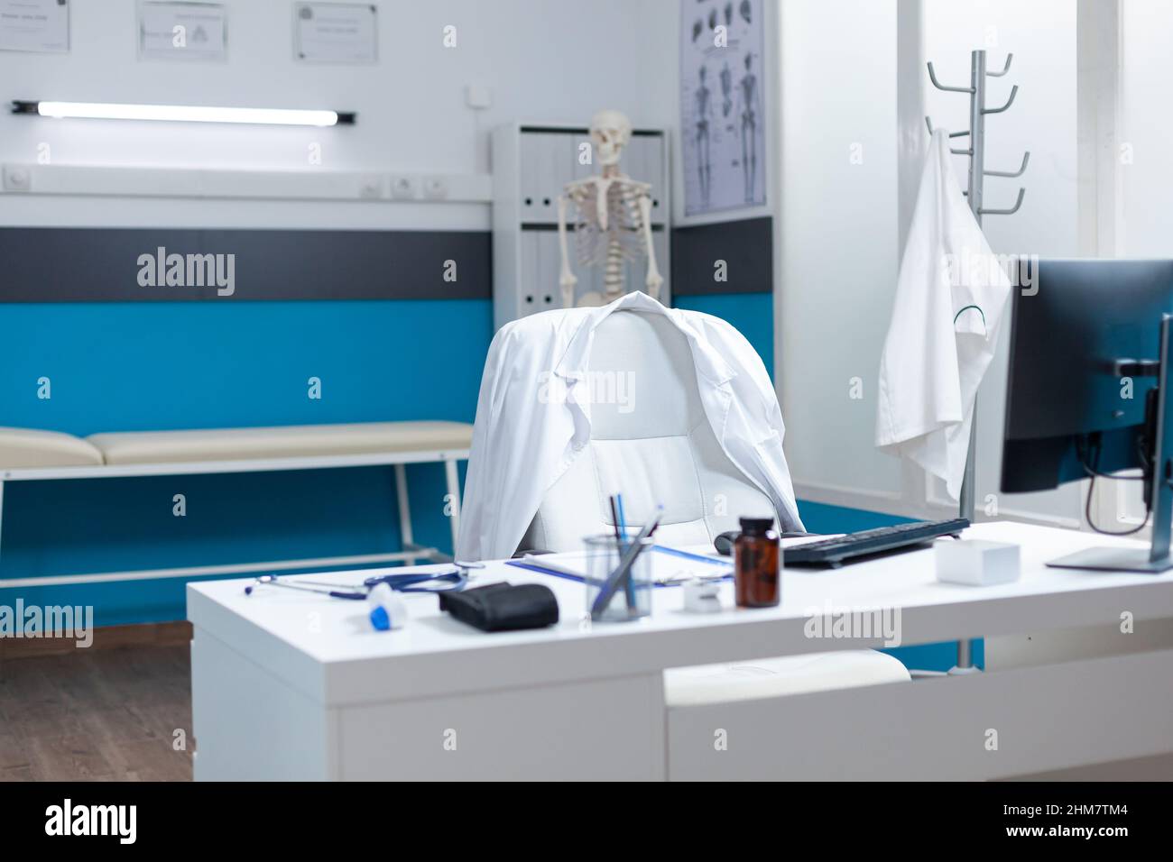 Empty modern medical office having disease documents on table equipped
