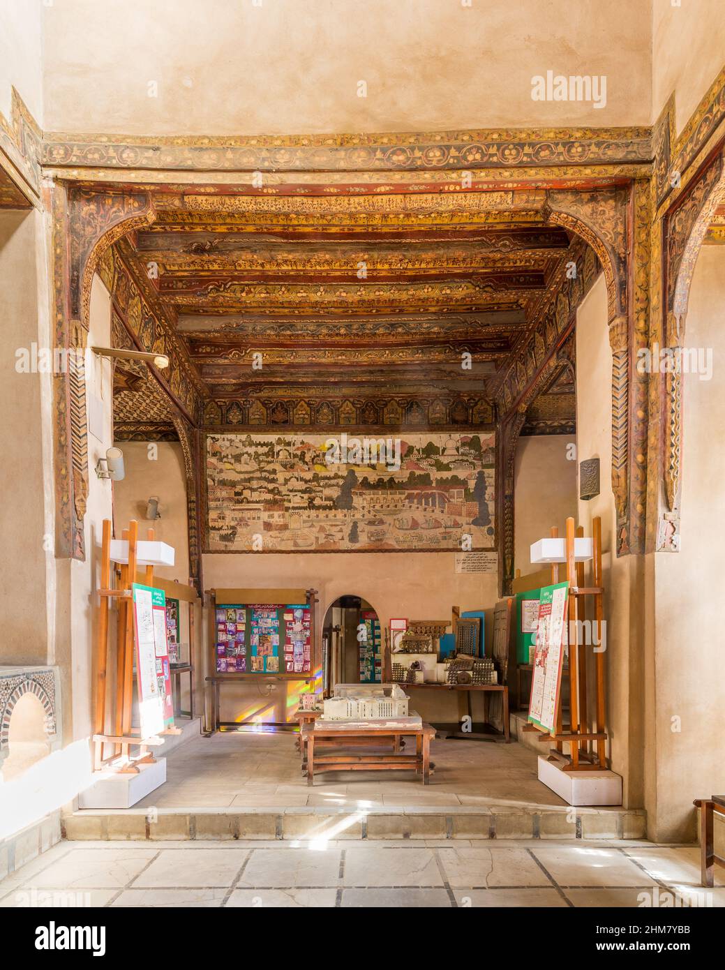 Hall at Ottoman era House of Egyptian Architecture building, aka Ali Labib House, Darb El Labbana district, off the citadel square, with decorated wooden ceiling and Turkish Golden Horn mural Stock Photo
