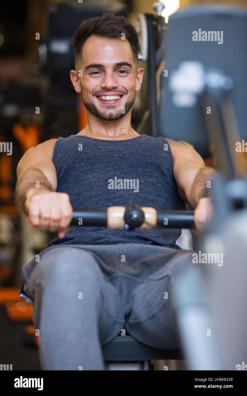 happy male athlete on rowing machine Stock Photo Alamy