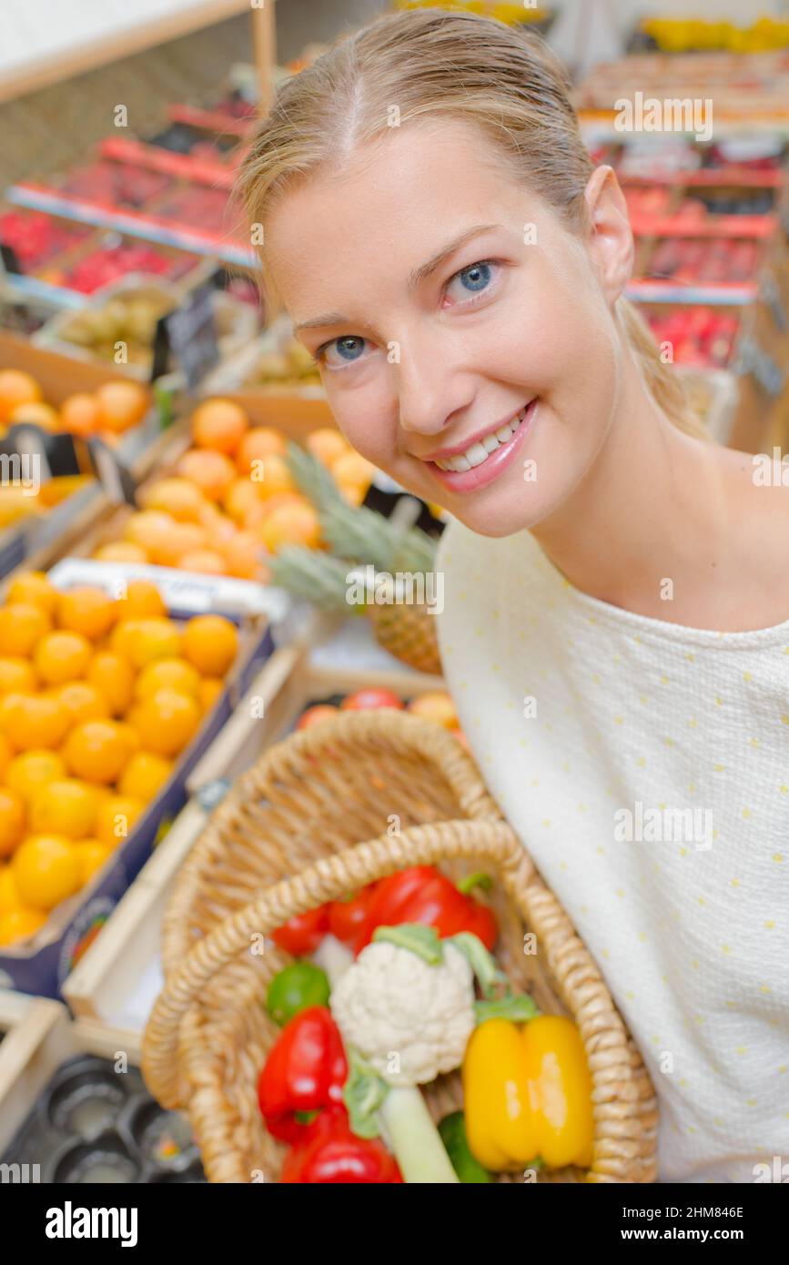 Lady holding basket of fruit & veg Stock Photo - Alamy