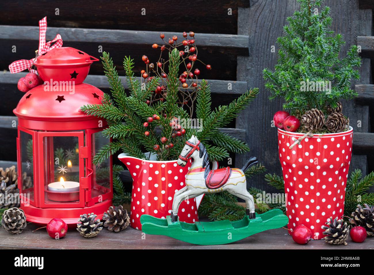 christmas decoration with rocking horse, coniferous and vintage lantern Stock Photo