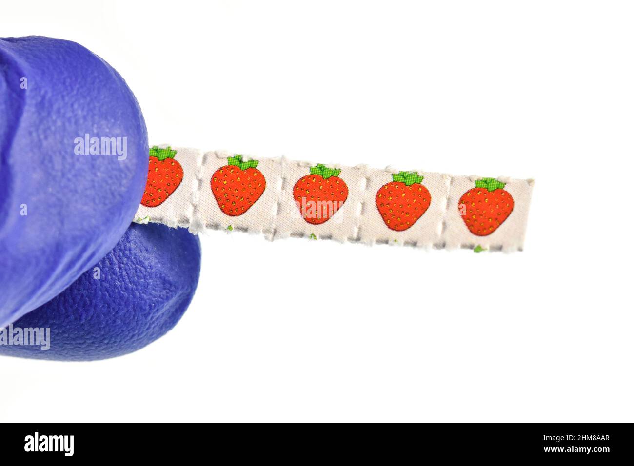 Strawberry trips-Blotting paper impregnated with the drug L.S.D.- Lysergic acid diethylamide. Stock Photo