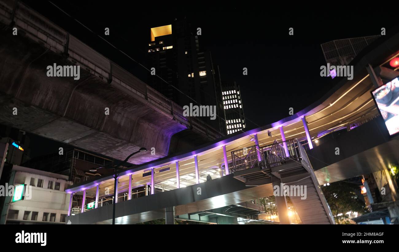 Asoke Skywalk At Asoke Bts Station With The Exchange Tower In The Asoke Skywalk At Asoke Bts Station With The Exchange Tower In The