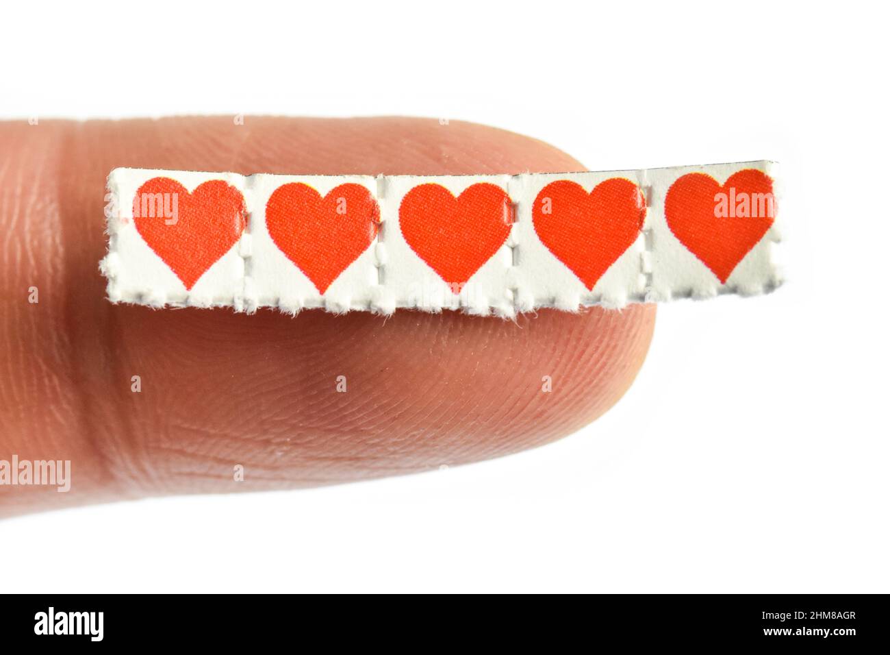 Love hearts trips,Blotting paper impregnated with the drug L.S.D.- Lysergic acid diethylamide. Stock Photo