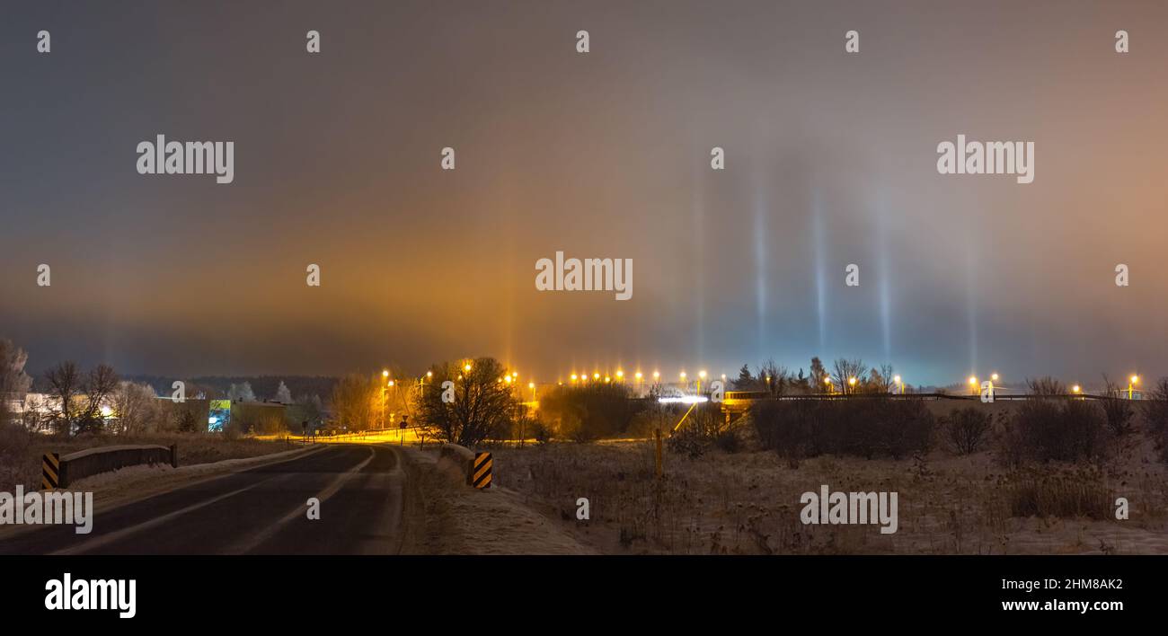 Light Pillars. Rare meteorological phenomena. Winter nature landscape