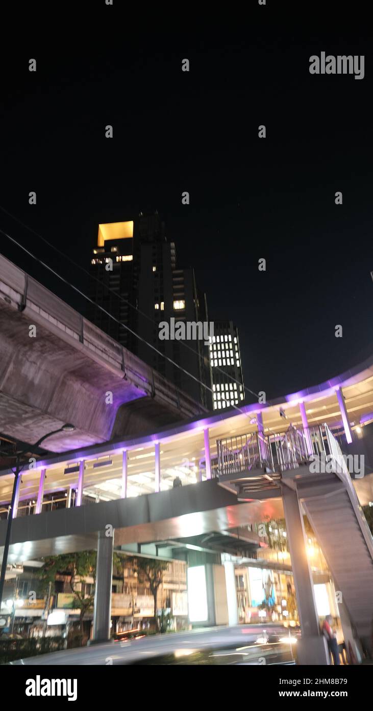 Asoke Skywalk At Asoke Bts Station With The Exchange Tower In The Asoke Skywalk At Asoke Bts Station With The Exchange Tower In The