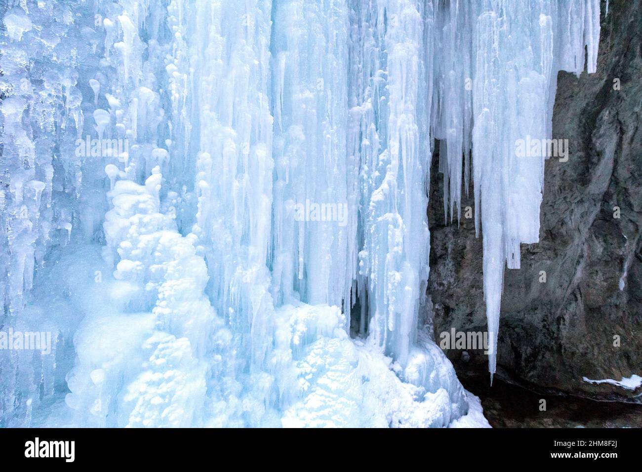 Huge icefall on a rock wall. Stock Photo