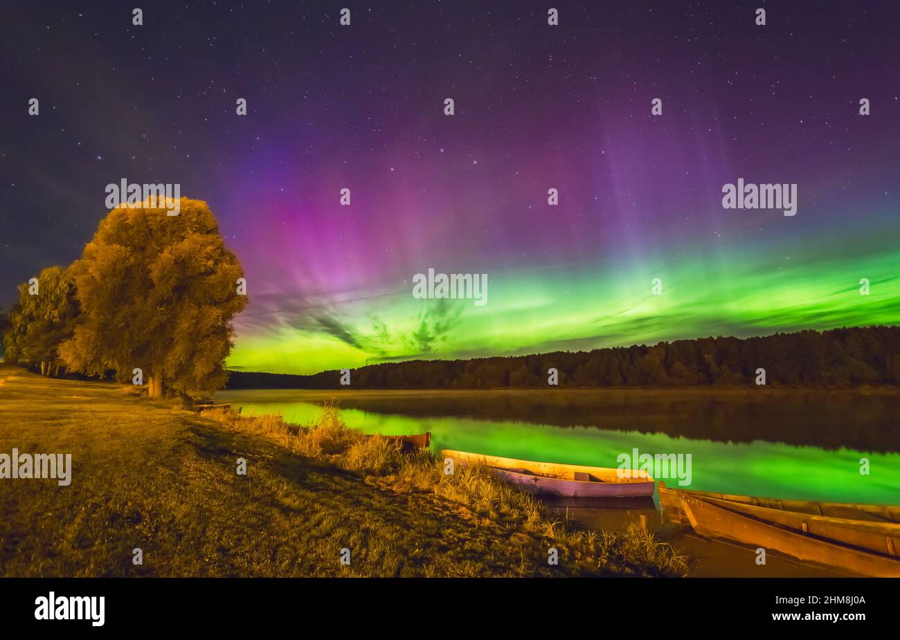 Milky way and Northern lights - Aurora borealis over the river Stock