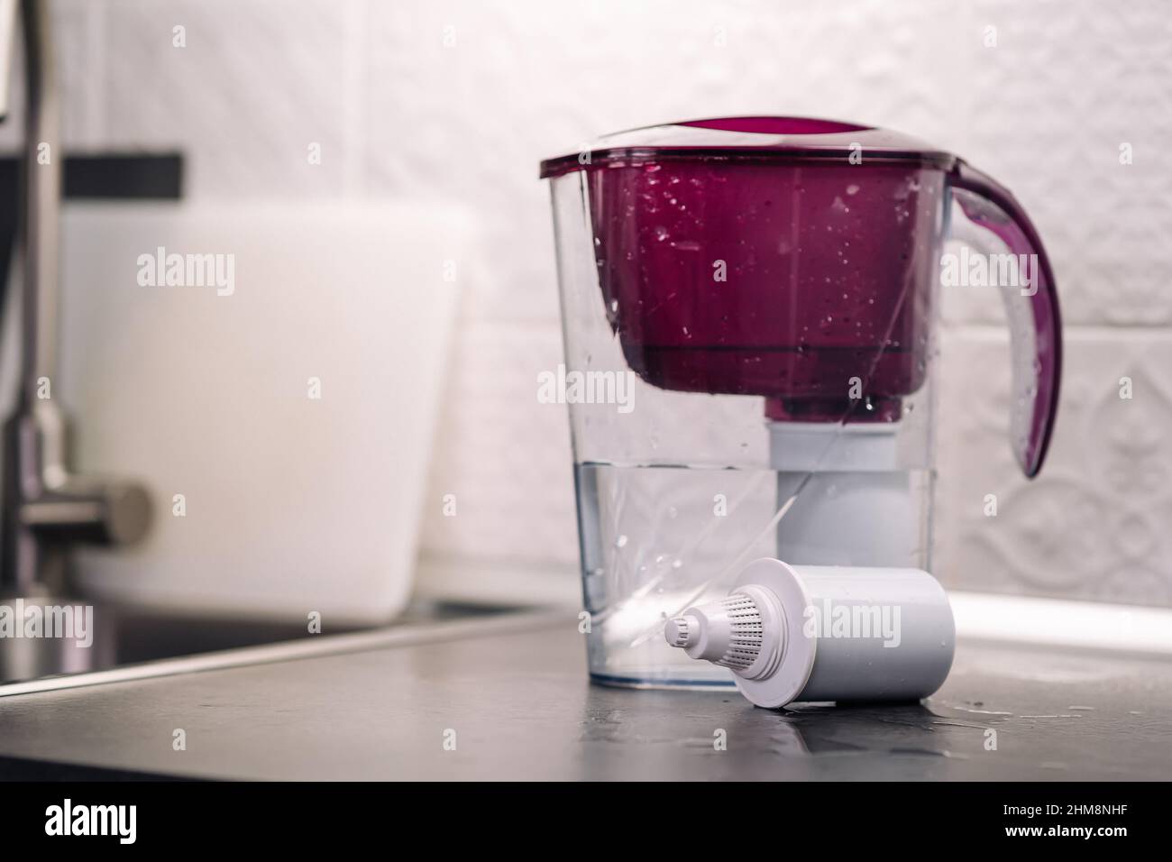 Absorbent substances in a plastic case. Water filter plastic jug with a