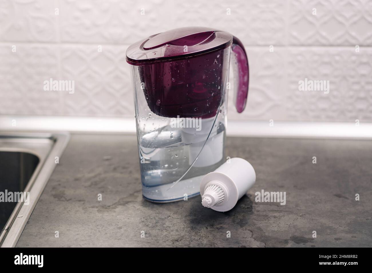 Absorbent substances in a plastic case. Water filter plastic jug with a