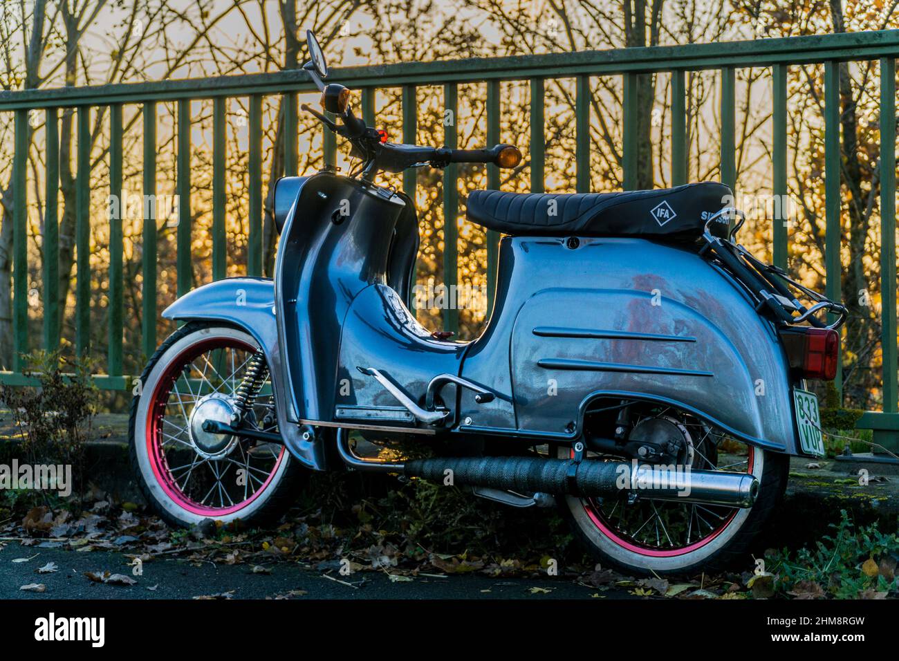 An old scooter from the DDR, refurbished shortly on a bridge Stock Photo