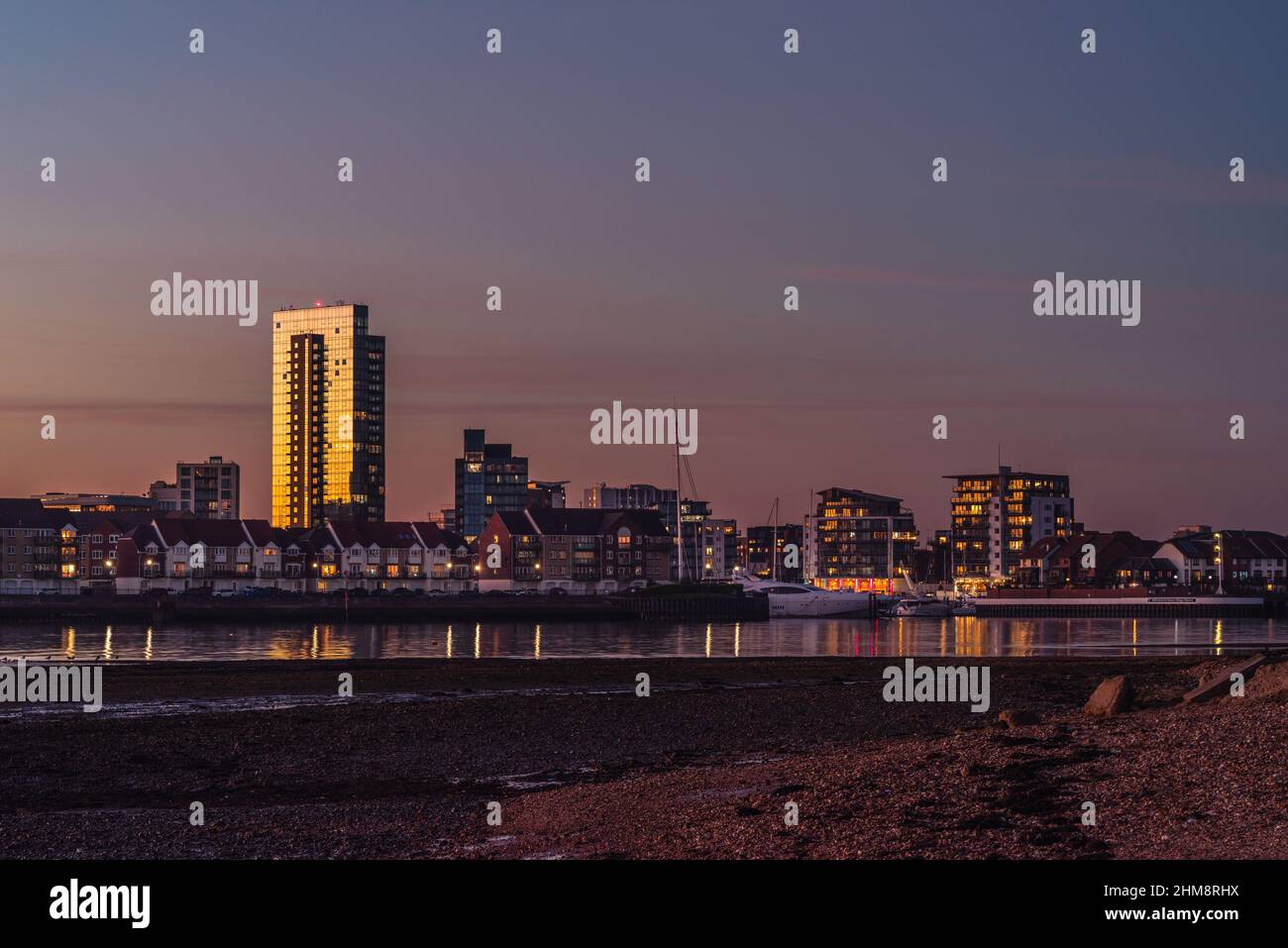 View from Weston towards Ocean Village Marina during dusk / sunset, Southampton cityscape skyline, Hampshire, England, UK Stock Photo
