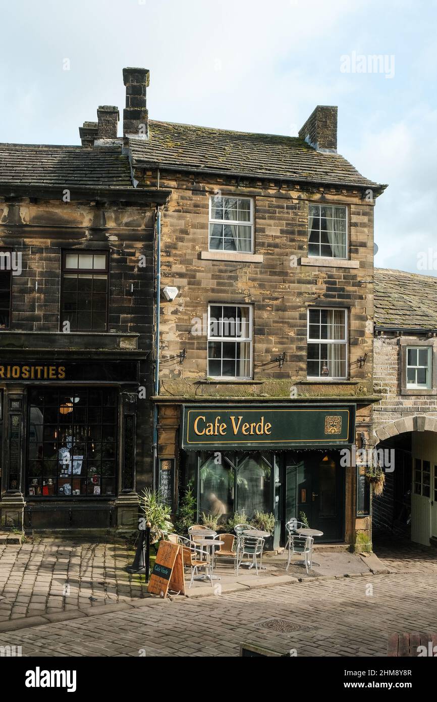 Haworth, UK: Main Street in Howarth, West Yorkshire attracts tourists from around the world because of its connections to the Bronte Sisters. Stock Photo