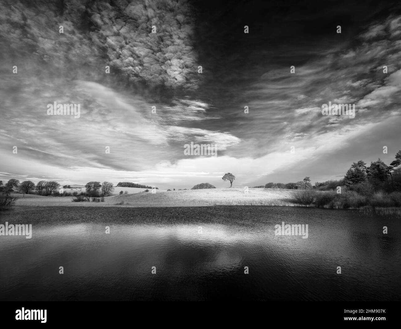 An infrared image of Waldergrave Pool at Priddy Mineries, the old mining landscape in the Mendip Hills National Landscape, Somerset, England. Stock Photo