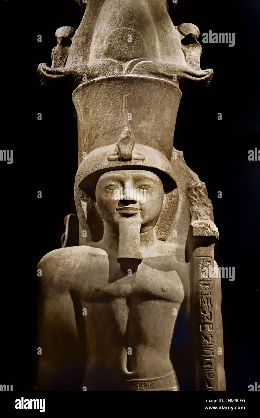 Statue of Egyptian Pharaoh Seti II wearing an Atef crown. Egypt (Museo Egizio di Torino Italy) Sety II Stone / sandstone, 516 x 113 x 165 cm, 1202–1198 BC, New Kingdom, Nineteenth, 19th  Dynasty Thebes, Karnak / temple of Amun, Stock Photo