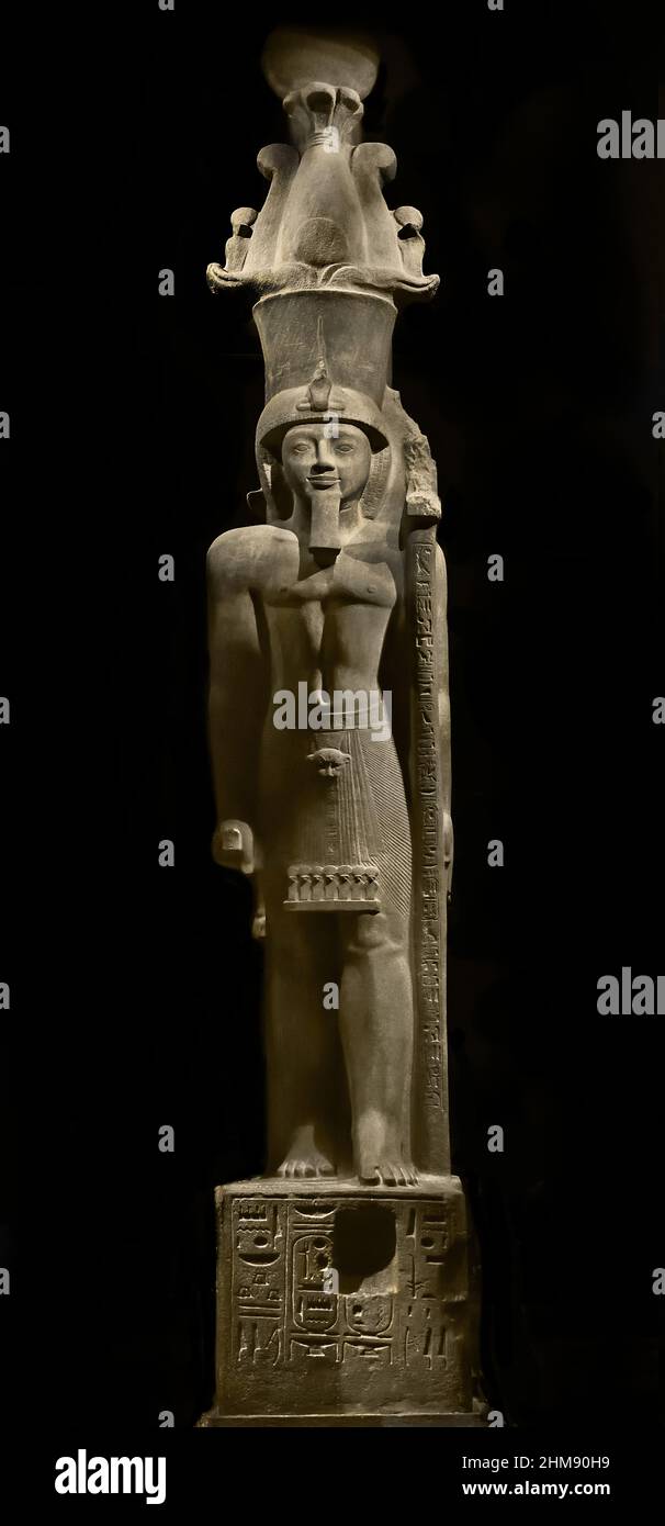 Statue of Egyptian Pharaoh Seti II wearing an Atef crown. Egypt (Museo Egizio di Torino Italy) Sety II Stone / sandstone, 516 x 113 x 165 cm, 1202–1198 BC, New Kingdom, Nineteenth, 19th  Dynasty Thebes, Karnak / temple of Amun, Stock Photo