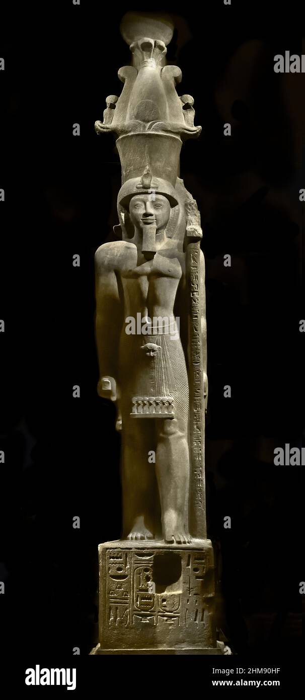 Statue of Egyptian Pharaoh Seti II wearing an Atef crown. Egypt (Museo Egizio di Torino Italy) Sety II Stone / sandstone, 516 x 113 x 165 cm, 1202–1198 BC, New Kingdom, Nineteenth, 19th  Dynasty Thebes, Karnak / temple of Amun, Stock Photo