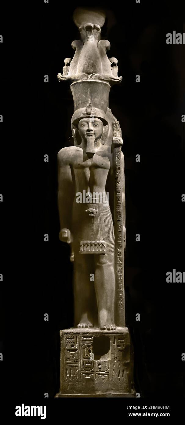 Statue of Egyptian Pharaoh Seti II wearing an Atef crown. Egypt (Museo Egizio di Torino Italy) Sety II Stone / sandstone, 516 x 113 x 165 cm, 1202–1198 BC, New Kingdom, Nineteenth, 19th  Dynasty Thebes, Karnak / temple of Amun, Stock Photo