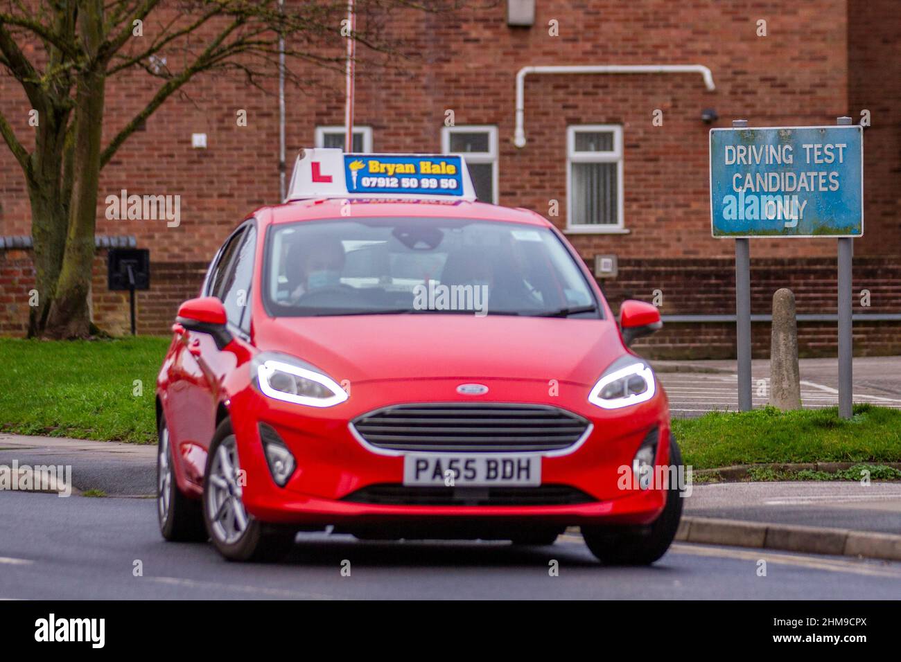 DVSA Driving Test Candidates Only sign, car learner drivers taking their test. 2018 red Ford Fiesta 1499cc diesel 6 speed manual in Southport, Merseyside, UK Stock Photo