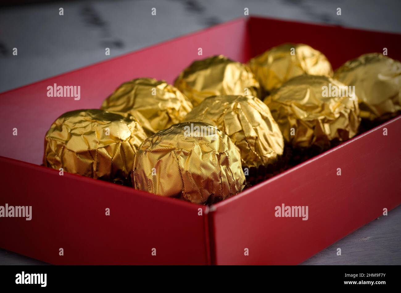 Delicious Chocolate in Gold Wrapping inside a Red Box Horizontal Stock Photo Alamy