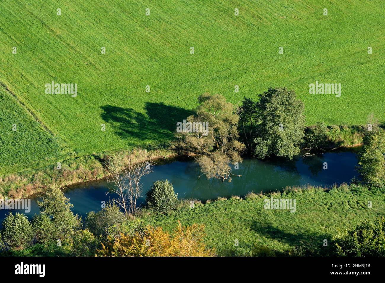 High angle view of landscape with the river Wiesent, trees and green fields in the Franconian Switzerland, Germany in October Stock Photo