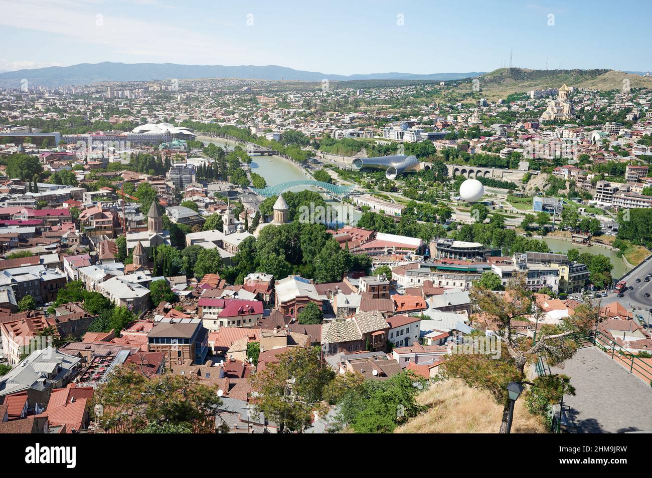 Rooftops in center Tbilisi city with old and modern districts aerial view Stock Photo