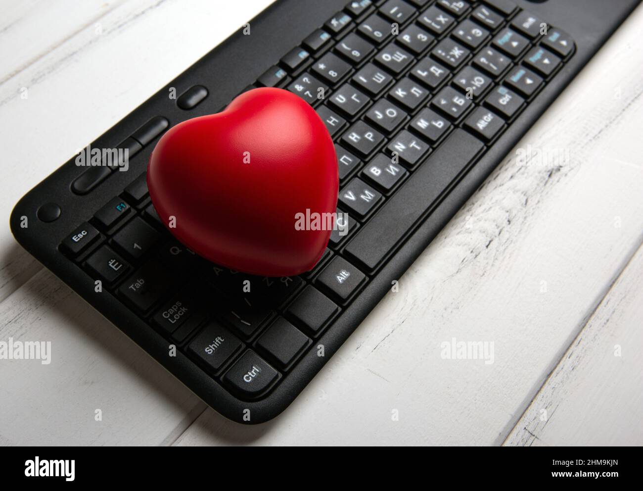 red heart on black pc keyboard of notebook website close up Stock Photo -  Alamy