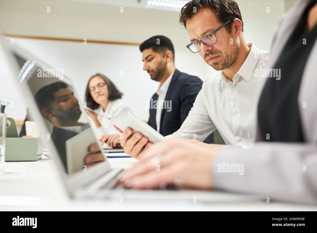 Business people work together in computer workshop or computer training Stock Photo