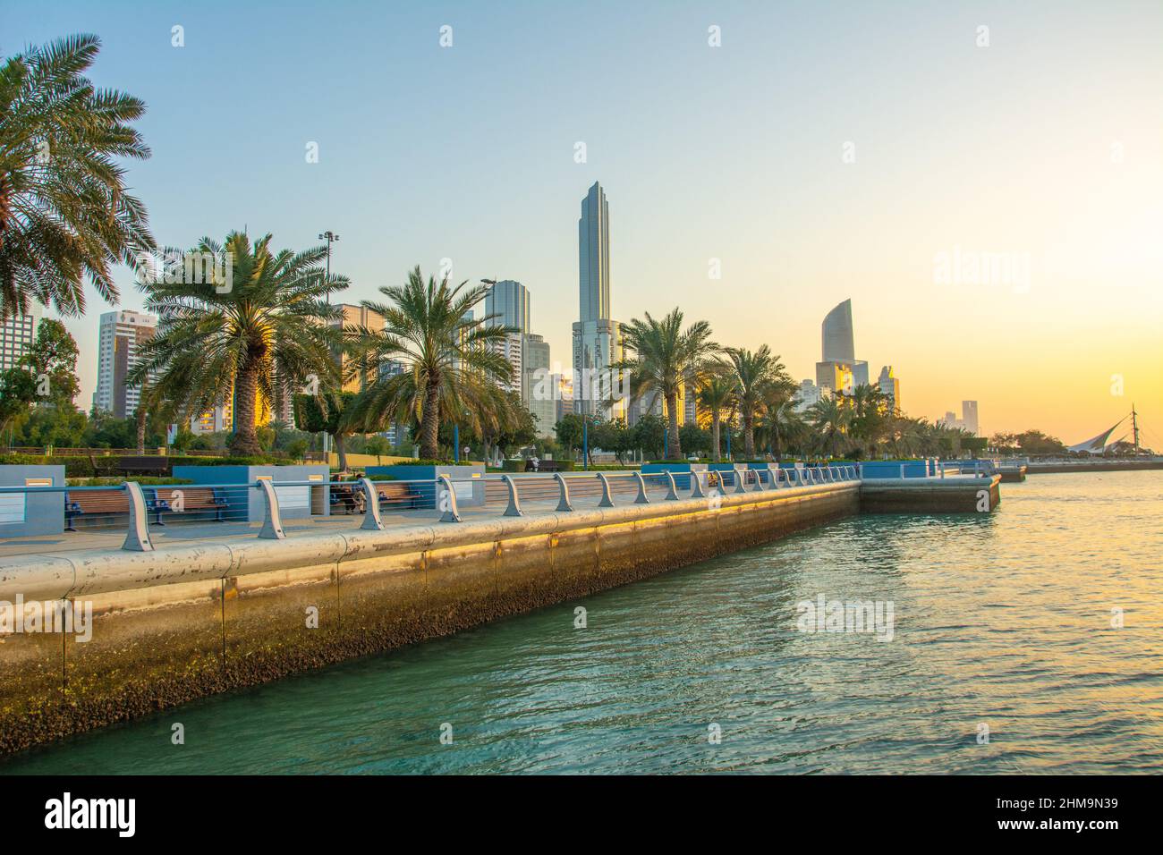 The view of the Corniche boulevard with high rises and palm trees on ...