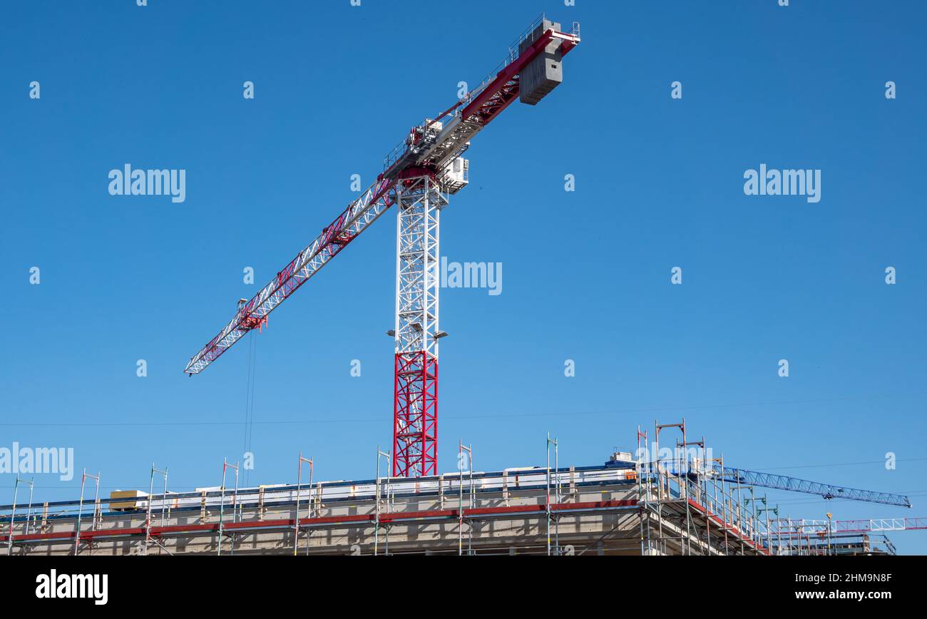 Construction crane on a construction site under construction Stock Photo
